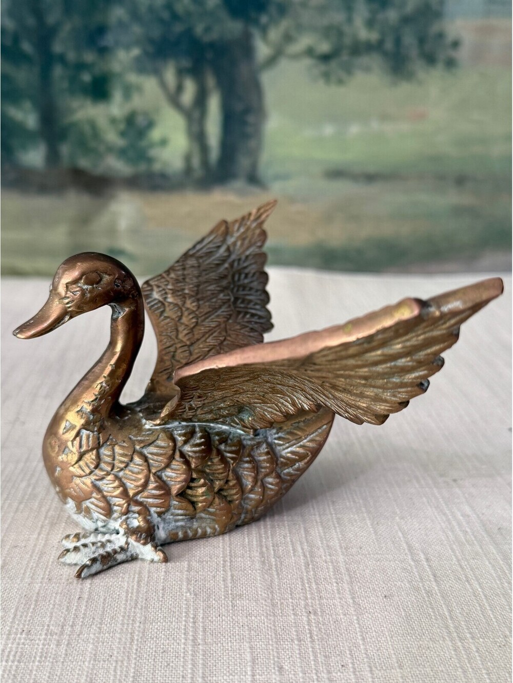 Brass duck figurine with spread wings